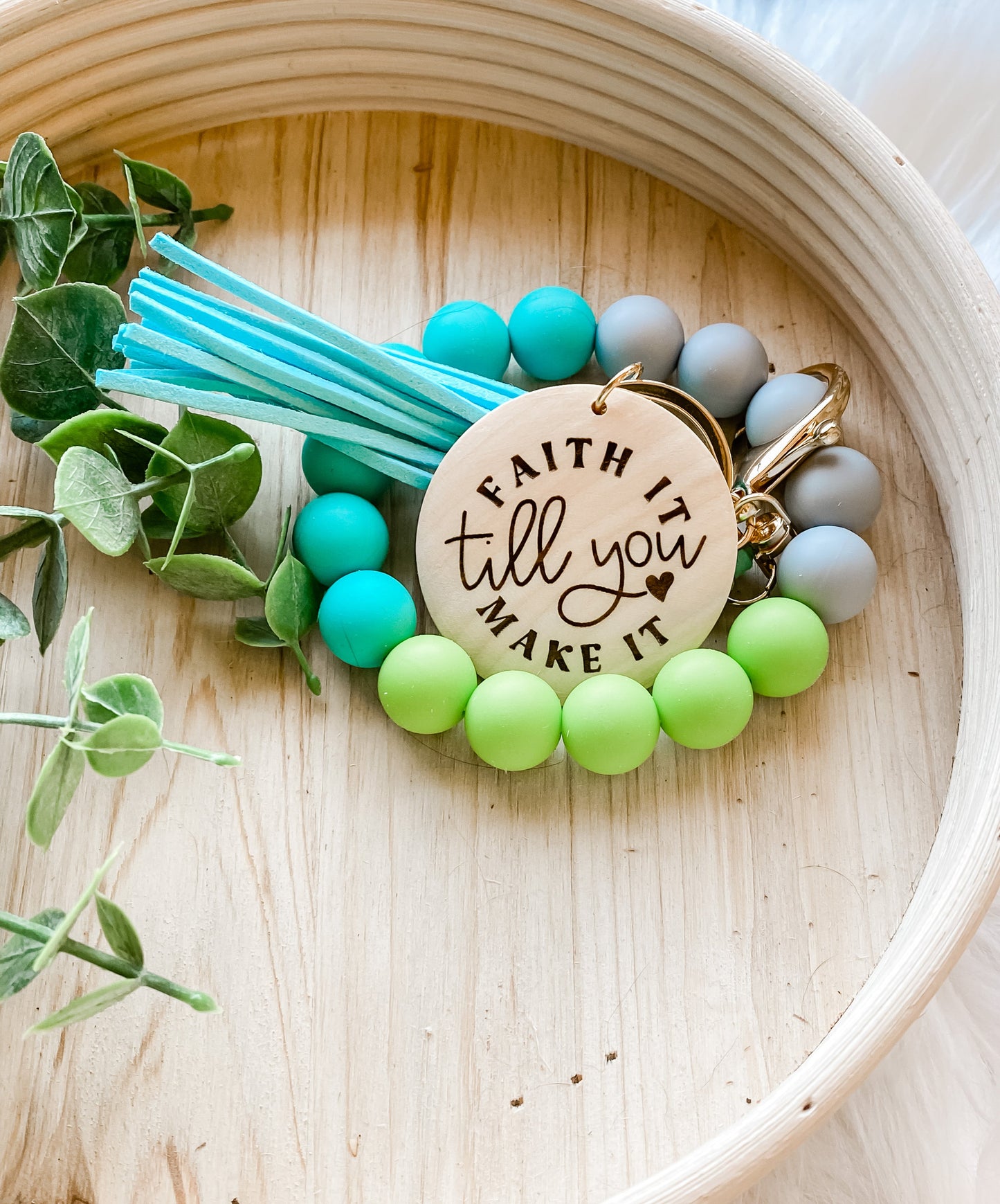 Faith it until you make it peacock wristlet